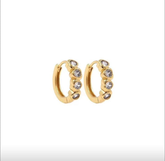 Gold hoop earrings with embedded stones on a white background